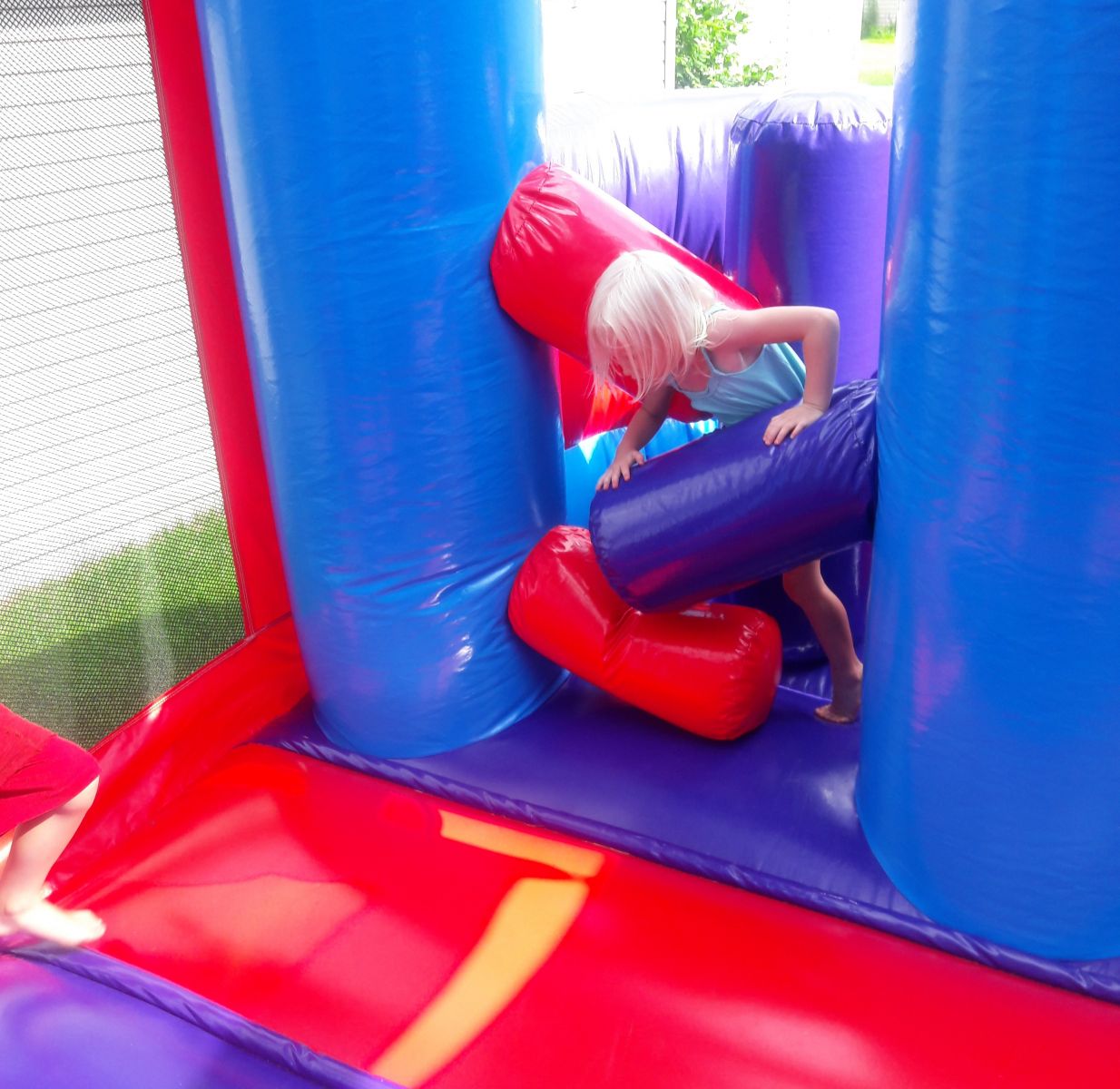 Inflatable obstacles inside combo bounce house rental